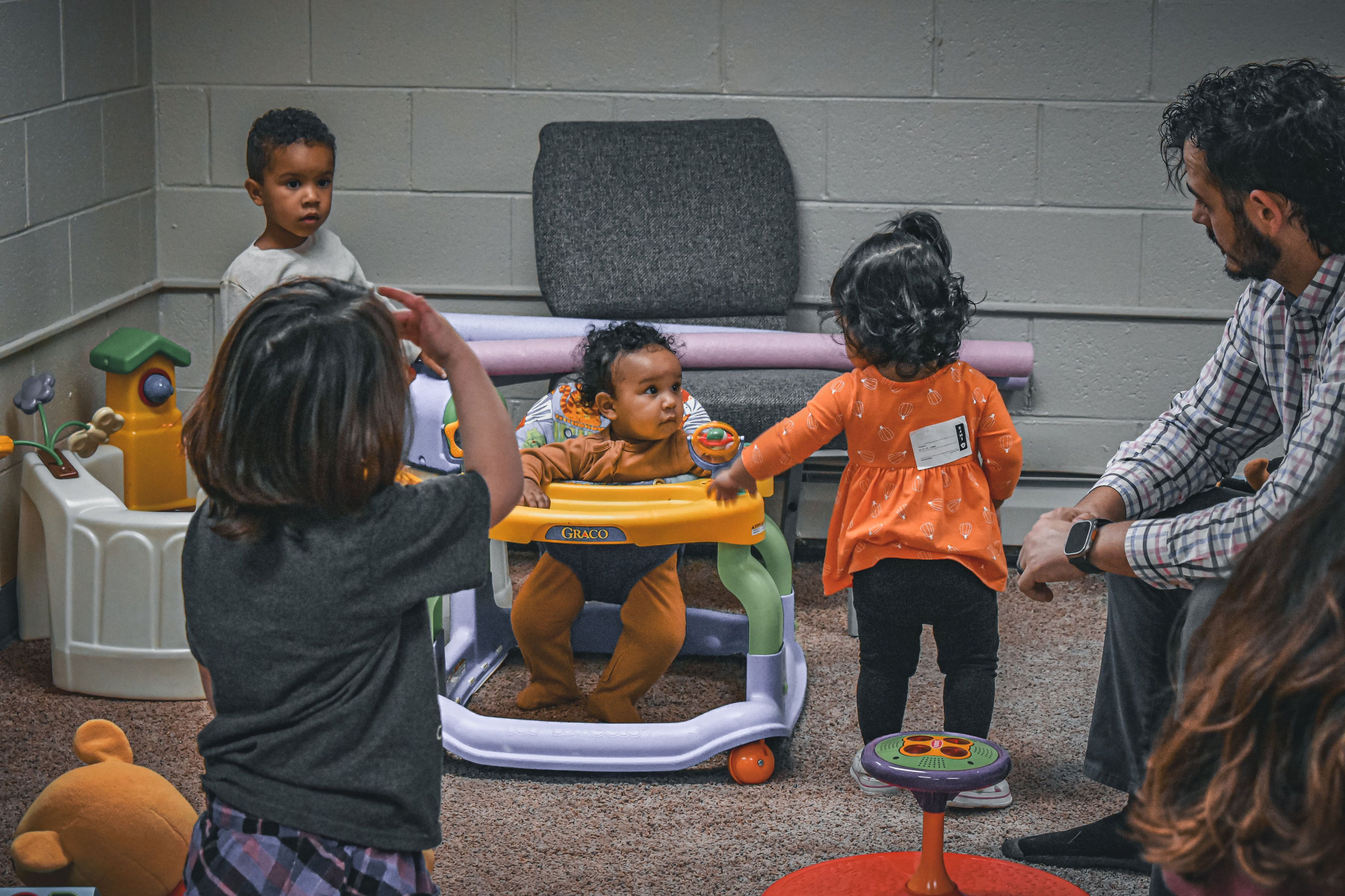 Adults caring for young children in the church nursery